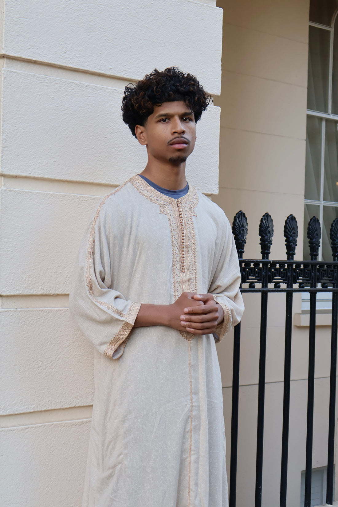 Man looking to the side, wearing a cream men&