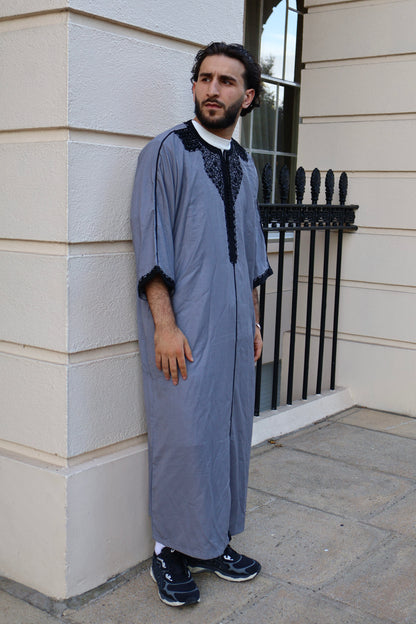 Man standing outdoors, wearing a 